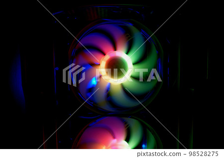 Colorful bright rainbow led rgb pc fan air case cooler. Computer chassis. Gaming modding, technology concept and IT background. Colorful bright rainbow led rgb pc fan air case cooler. Computer chassis. Gaming modding, technology concept and IT background. 98528275