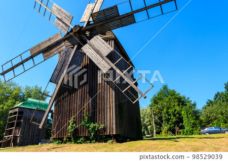 Old wooden windmills in Pyrohiv (Pirogovo) village near Kiev, Ukraine Old wooden windmills in Pyrohiv (Pirogovo) village near Kiev, Ukraine 98529039