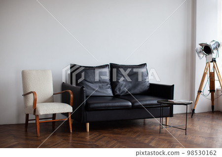 Retro interior with black sofa. Retro interior with black sofa. 98530162