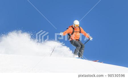 Descent during ski mountaineering trip Descent during ski mountaineering trip 98530596