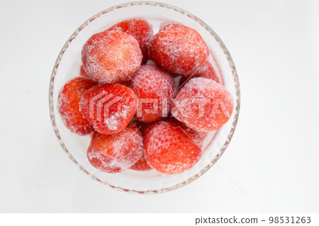 Frozen strawberries on a plate, frozen strawberries, frozen fruits, frozen vegetables, frozen strawberries 98531263