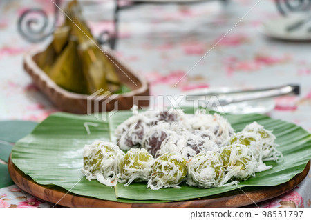 Coconut Dumplings (Kanom Tom) and Sweet Stuffed Dough (Kanom Sai Sai), Thai traditional sweet dessert. Coconut Dumplings (Kanom Tom) and Sweet Stuffed Dough (Kanom Sai Sai), Thai traditional sweet dessert. 98531797