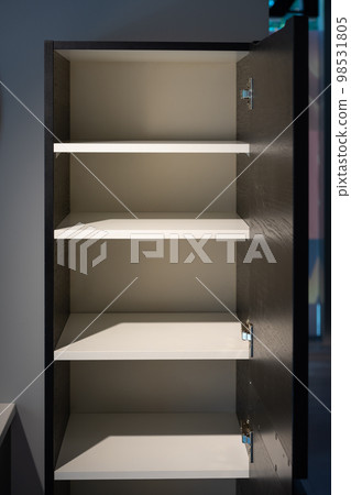 a empty black and white cabinet wood in modern and minimal style in front of wall in the restroom. a empty black and white cabinet wood in modern and minimal style in front of wall in the restroom. 98531805