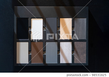 Material Example of wood type and colour for customer in kitchen showroom, show texture and design of their material. Material Example of wood type and colour for customer in kitchen showroom, show texture and design of their material. 98531825