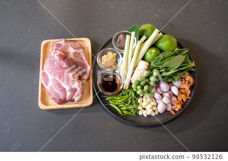 topview flatlay of Raw Pork and herb ingredients, preparation for Cooking in Thai food menu. Clipping Paths. topview flatlay of Raw Pork and herb ingredients, preparation for Cooking in Thai food menu. Clipping Paths. 98532126