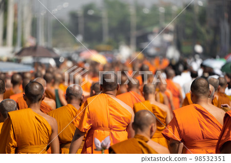 a group of monk on pilgrimage walk on the street at noon time, Thailand. 98532351