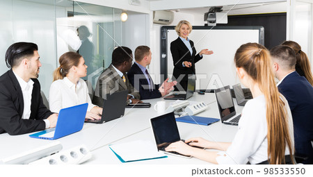 mature female chief gathering her managers for conference mature female chief gathering her managers for conference 98533550