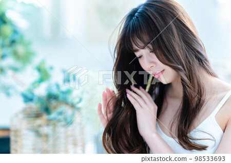 Young women doing hair care 98533693