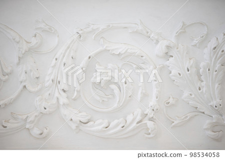 White swirling plaster pattern. Organic plaster patterns. Vintage white ceiling 98534058