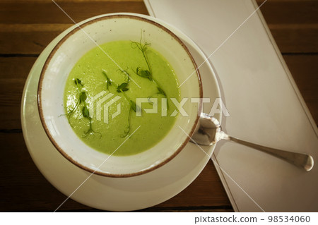 Brocali puree soup shot from above. Diet vegetarian food for lunch. Brocali puree soup shot from above. Diet vegetarian food for lunch. 98534060