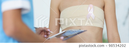 Doctor examination of female breast and oncology Doctor examination of female breast and oncology 98534202