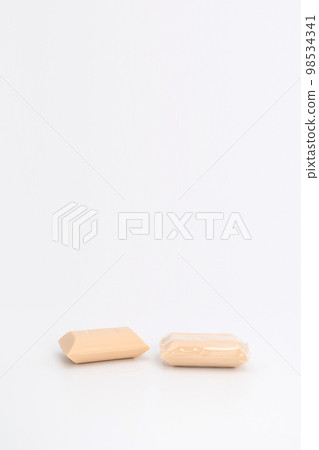 2 creamy color soaps in studio light on white background. one none wrap and another one is. Clipping Paths.. 98534341
