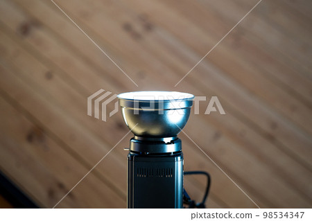 spotlight led is hung on to wood ceiling in the event room. 98534347