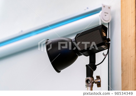 close up to Studio LED sportlight on tripod and standy in the event room. 98534349