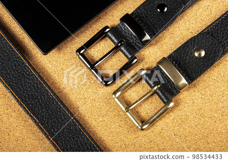 Part of leather belts with metal buckles. Part of leather belts with metal buckles. 98534433