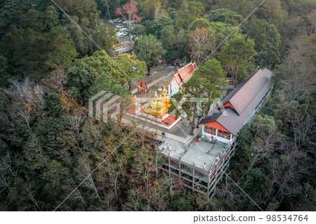 Wat Phra That Doi Tung from above birdeyes view, a famous Temple and Buddhism place. It's settled on the mountain in Chiang Rai province, north of Thailand. Wat Phra That Doi Tung from above birdeyes view, a famous Temple and Buddhism place. It's settled on the mountain in Chiang Rai province, north of Thailand. 98534764