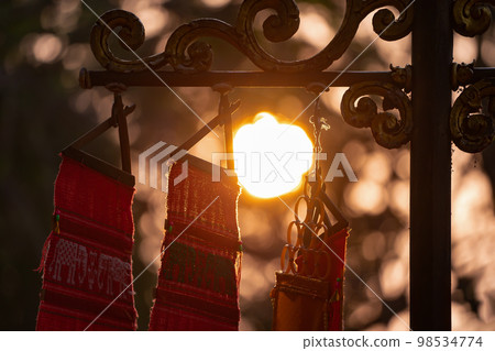 Silhouette TUNG Tree, The spiritual flag for victory and brightness of life. Shoot at Wat Phra That Doi Tung, Chiang Rai Province, North of Thailand 98534774
