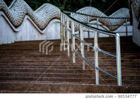 Stairs way in the jungle environment, at Wat Phra That Doi Tung temple, Chiang Rai Province, North of Thailand. 98534777