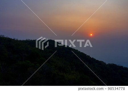 PM 2.5 in Sunrise view with the mountain foreground at Chiang Rai province, North of Thailand on 25 Mar 2021 morning 7.00 am. PM 2.5 in Sunrise view with the mountain foreground at Chiang Rai province, North of Thailand on 25 Mar 2021 morning 7.00 am. 98534778