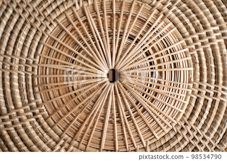 Close up to Round Circle woven straw mat Wicker pattern of local Thai handmade craft. 98534790