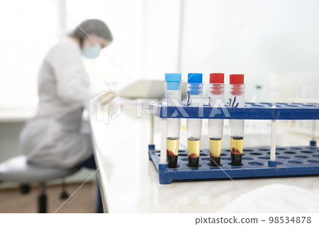 Blood transfusion station.Nurse with blood tests.Blood in test tubes. Blood transfusion station.Nurse with blood tests.Blood in test tubes. 98534878