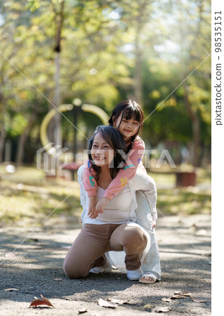 Asian Grandmother and Granddaughter hug together outdoor park. Hobbies and leisure, lifestyle, family life, happiness moment concept Asian Grandmother and Granddaughter hug together outdoor park. Hobbies and leisure, lifestyle, family life, happiness moment concept 98535151