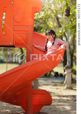 Happy Asian children playing at playground at outdoor park 98535172