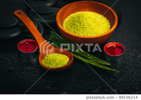 Spa concept. Zen basalt stones and aloe vera on the black basalt background. Spa concept. Zen basalt stones and aloe vera on the black basalt background. 98536214