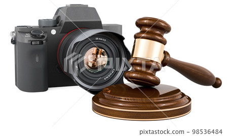 Wooden gavel with digital camera. 3D rendering Wooden gavel with digital camera. 3D rendering 98536484