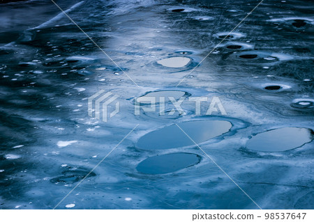 Frozen lake surface 98537647