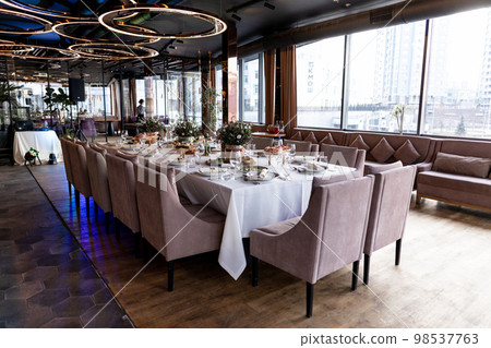 wedding festive table in a restaurant with food and decor wedding festive table in a restaurant with food and decor 98537763
