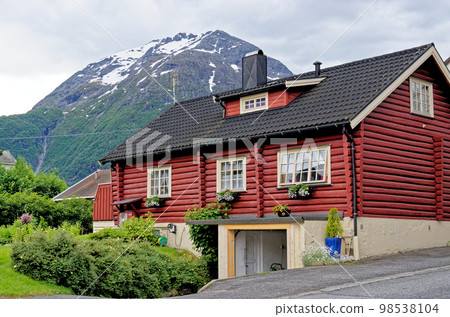Wooden house in village countryside rocky hills - Andalsnes - Norway Wooden house in village countryside rocky hills - Andalsnes - Norway 98538104