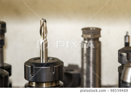 Close-up scene the group of the flat end mill tool for CNC milling machine. Close-up scene the group of the flat end mill tool for CNC milling machine. 98539489