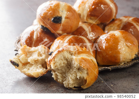 Homemade Hot Cross Buns Ready for Easter closeup on the plate. Horizontal Homemade Hot Cross Buns Ready for Easter closeup on the plate. Horizontal 98540052