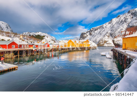 Amazing morning seascape of Norwegian sea and cityscape of Nusfjord village. Amazing morning seascape of Norwegian sea and cityscape of Nusfjord village. 98541447
