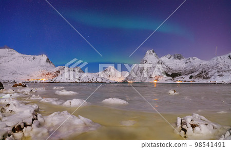 Fabulous frozen Flakstadpollen and Boosen fjords with Northern Lights at night. Fabulous frozen Flakstadpollen and Boosen fjords with Northern Lights at night. 98541491