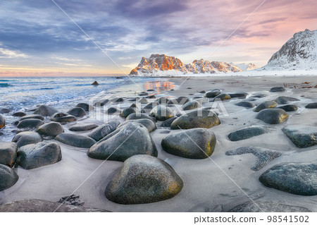 Astonishing winter scenery on Uttakleiv beach at sunset time. 98541502