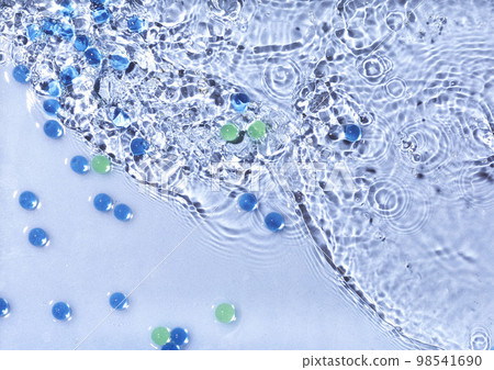 Abstract water, cosmetic background with waves and ripples and glass granules. Concept of therapeutic moisturizing cosmetics 98541690