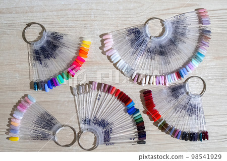 Samples of nail gel polish as palettes in manicure salon Samples of nail gel polish as palettes in manicure salon 98541929