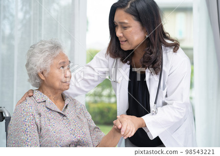 Doctor help and care Asian senior or elderly old lady woman patient sitting on wheelchair at nursing hospital ward, healthy strong medical concept 98543221
