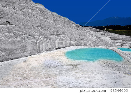 View of natural travertine pools and terraces in Pamukkale. Cotton castle in southwestern Turkey 98544603