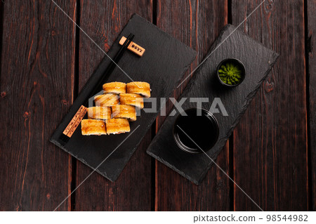 Sushi roll with smoked tuna with cucumber and cheese top view. Traditional delicious fresh sushi roll set. Sushi menu. Japanese cuisine restaurant. Asian food 98544982