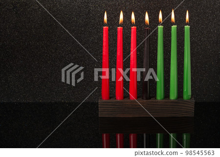Kwanzaa festival concept with seven candles  98545563