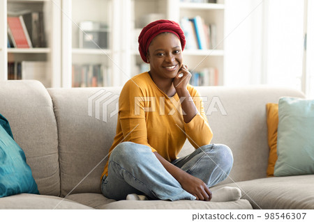 Cheerful african american woman chilling alone at home, copy space Cheerful african american woman chilling alone at home, copy space 98546307