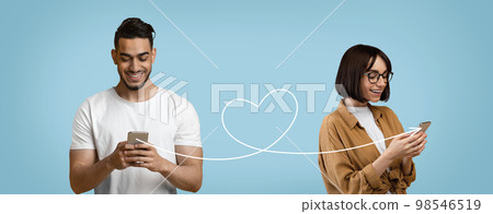 Young Male And Female Sending Romantic Messages With Smartphone In Dating App Young Male And Female Sending Romantic Messages With Smartphone In Dating App 98546519