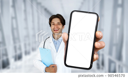 Medical Insurance. Handsome Male Doctor Holding Smartphone With Blank Screen In Hand 98546570