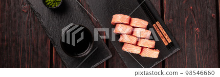 Banner Roll with fish sushi and chopsticks top view copy space - asian food concept Banner Roll with fish sushi and chopsticks top view copy space - asian food concept 98546660