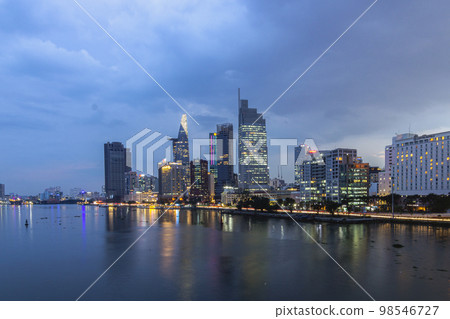 Saigon, Vietnam - Oct 24, 2022 - Impression landscape of Ho Chi Minh city at night, Saigon river flows through the city. High-quality photo. High-quality photo 98546727