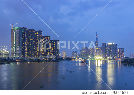 Saigon, Vietnam - Oct 24, 2022 - Impression landscape of Ho Chi Minh city at night, Saigon river flows through the city. High-quality photo. High-quality photo 98546731