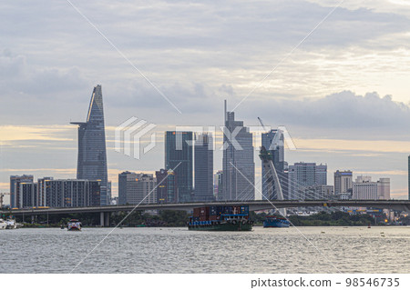 Saigon, Vietnam - Oct 24, 2022 - Impression landscape of Ho Chi Minh city at night, Saigon river flows through the city. High-quality photo. High-quality photo 98546735